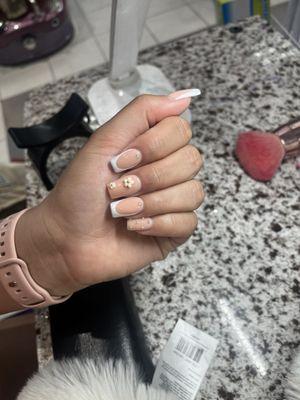 French tip with flowers and stones and powder halo