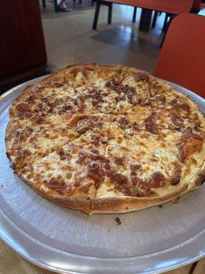 Large pizza with bacon and pepperoni