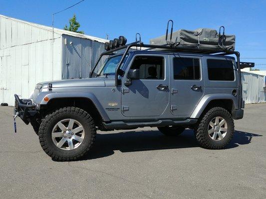 4" Rough Country lift, 35" tall mud terrains installed by Swier Tire - Jeep Unlimited 4x4