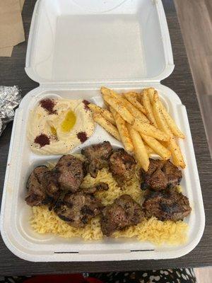 Lamb kabob combo complete with hummus and fresh hot fries