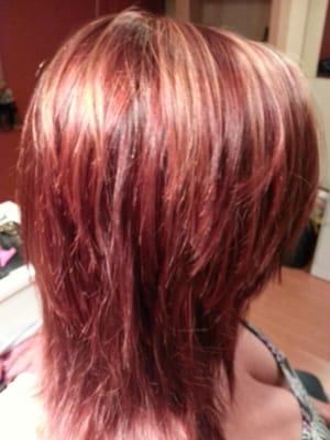 Vibrant red hues with light copper and blonde dimension