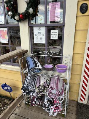 Dog bowls & lavender-colored Mexican blankets