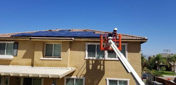 Removing birds from underneath solar panels.  We even clean the panels.