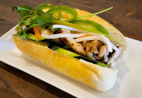 Chicken Banh Mi Sandwich - Grilled chicken, pickled carrots, cucumbers topped with jalapenos and cilantro on a freshly baked baguette