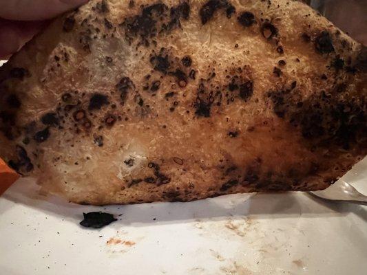 Burnt pizza bottom