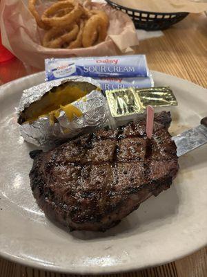 Cow girl ribeye medium rare, and "loaded" baked potato. Side of green beans came later.