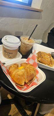 Matcha latte, blender caramel machiatto, croissant egg cheese and sausage sandwich,  French toast