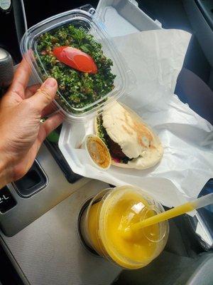 Homemade fresh Falafel pita, AMAZING ginger sauce. Tabula! And Mango smoothie..... HEAVEN!  Smiling from ear to ear.