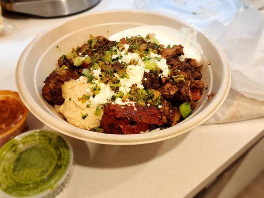 Half Blk. Lentils/Br. Rice, Tzatziki, Hummus, Harissa, Half Falafel/Extra Chicken, Fiery Broccoli, Tmto+Cucs, Feta, Skhug, Harissa Ving.