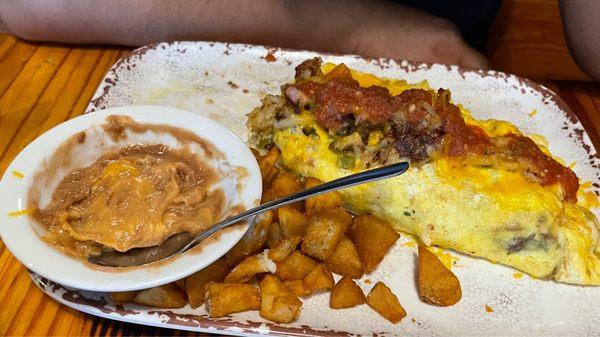 Old West Omelette, fried potatoes and refried beans w/ cheese.