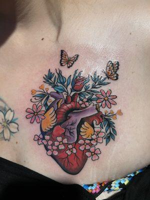 Heart tattoo w/ butterflies and flowers in color.
Done by -SKETCH