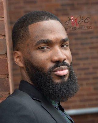 Low skin fade and beard tapered