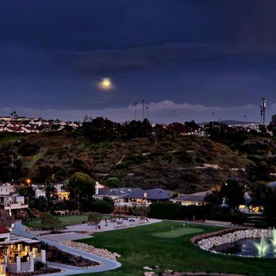 View of full moon above Shorecliffs Golf Course  and Everleigh Apartments.