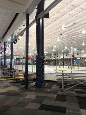 The ice skating rink with bleachers in front. Notice the swirly shaped neon tube lighting..YASS!