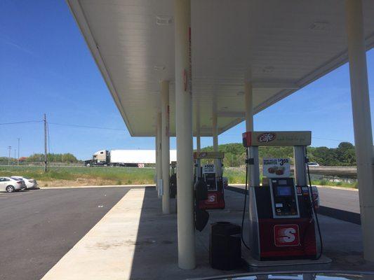 Filling up cheap gas on a beautiful day.