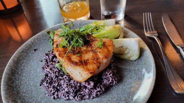 Sea bass over coconut milk black rice ($60)