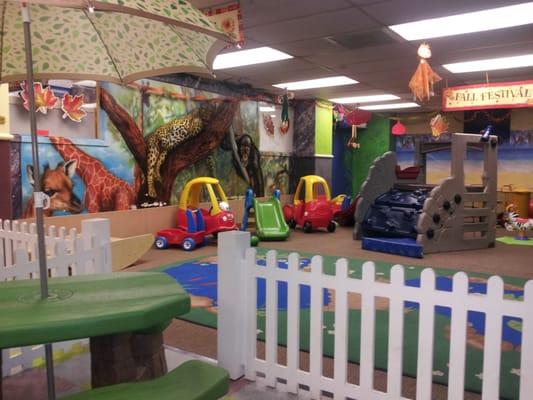 Our cozy lobby overlooks our indoor gross motor (movement) play space. We're all wild for the "Jungle Room" !