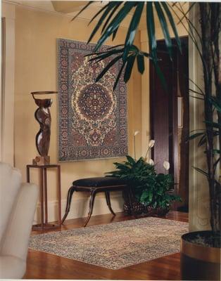 Many clients hang rugs as striking wall art (wall: antique Ferahan Sarouk, floor: antique Laver Kirman.)