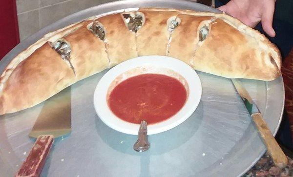 Cheese steak stromboli w/delicious sauce.