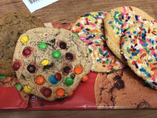 Assortment of cookies: chocolate, rainbow  sprinkles, and chocolate chip with M&M candies