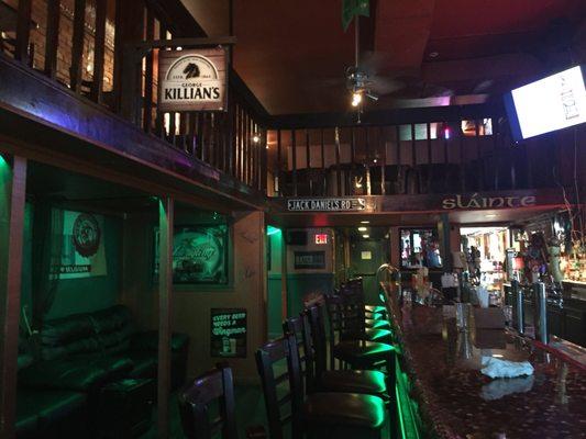 Another interior shot.  Shows the leather couches and upstairs with cute little pub tables.