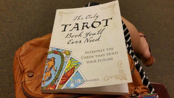 Reading the best book on tarot I've encountered so far from a comfy chair!