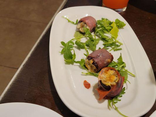 Goat cheese stuffed figs wrapped in prosciutto. The arugula added just the right peppery bite to compliment the sweet figs.