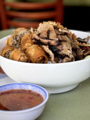 Vermicelli noodles with bbq pork and spring rolls