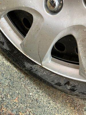 Cracked hubcap after reinstalled at Town Fair Tire