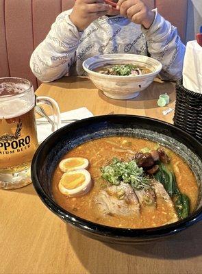 Tantan men in the white bowl. Spicy miso ramen in the black bowl and a refreshing Sapporo beer on the side!