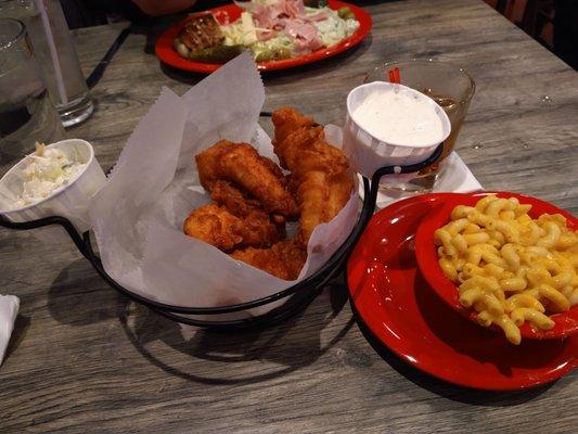 Beer battered fresh chicken tenders, coleslaw, Mac and cheese