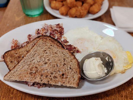 Corned beef hash with a side of tots