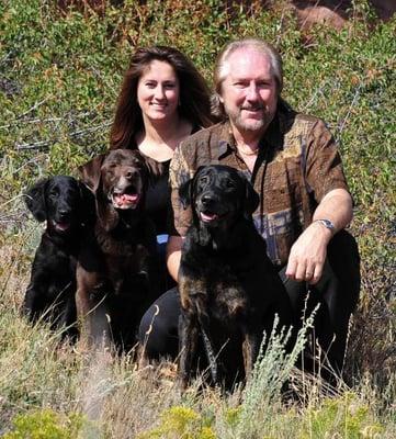 Tiffany and Ted with Gunner (Flatcoated Retriever), Charlie (Labrador Retriever) and Boone (Coonhound mix).