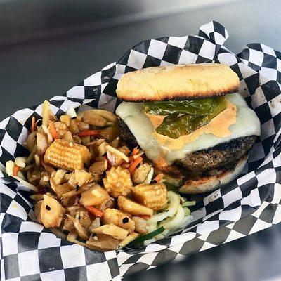 Black Thai Burger Served on an English Muffin and Topped with Munster Cheese, Shishito Peppers and Bolo Sauce. Served with Zoodles.