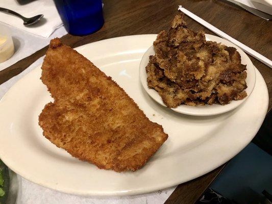 Fried flounder with a side of onion and sage dressing