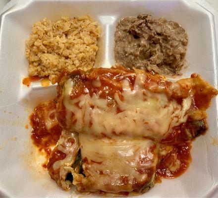 Chile Rellenos stuffed with Cream Cheese and covered with Red Sauce and Shredded Cheese - Sides of Refried Beans and Rice