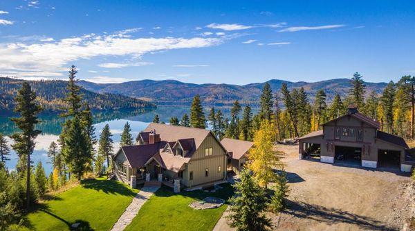 Perched above Ashley Lake with 180-degree lake and mountain views, this Montana modern property features 500+/- feet of lake frontage.