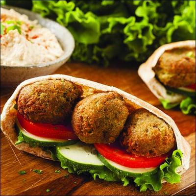 Pita Filled with Fried Fava Beans, Tomatos, and Lettuce with Tahini Sauce.