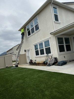 Robert marking the placement of the netting under the eaves