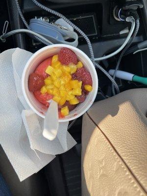 Strawberry Italian Ice topped w/ mangos and strawberries