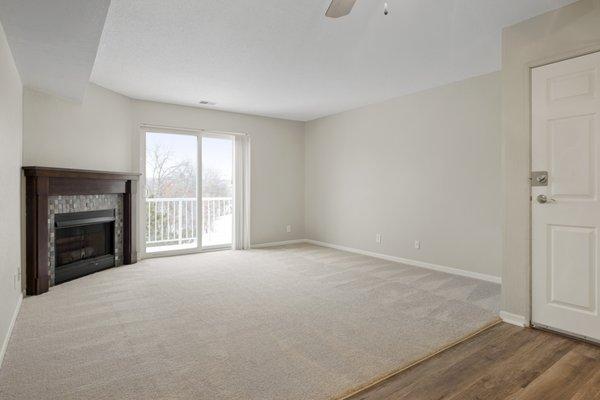 Spacious living rooms feature a balcony and fireplace.