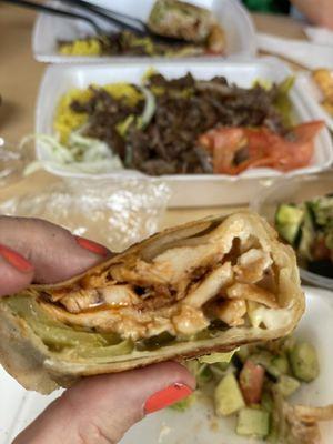 Traditional chicken shawarma in forground; beef shawarma with rice in background