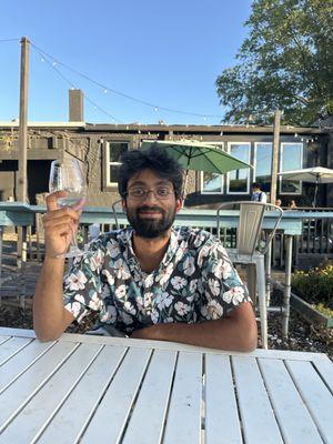 My friend Surya and his empty wine. It was a jammy sparkling wine and he loved it!