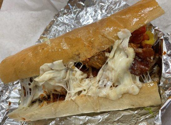 Meatball sub.  Keep it wrapped in the foil and you'll keep your hands clean