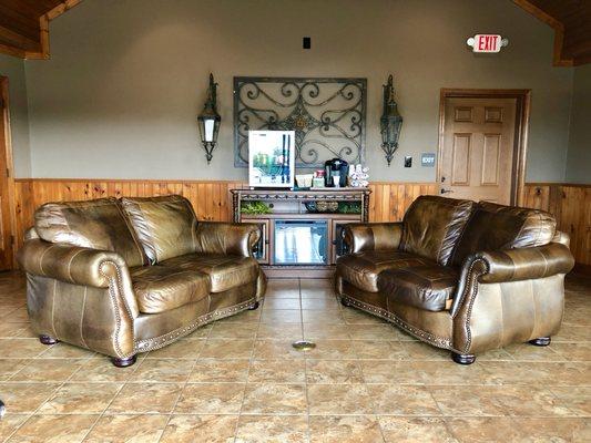 Upon walking into our store you're greeted by our comfortable waiting area, complete with a drink cooler and a Keurig.