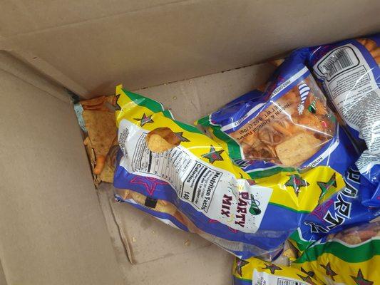 Looks like a mouse bit into the chip bag. It was rat poop and chips all in this box (zoom in)