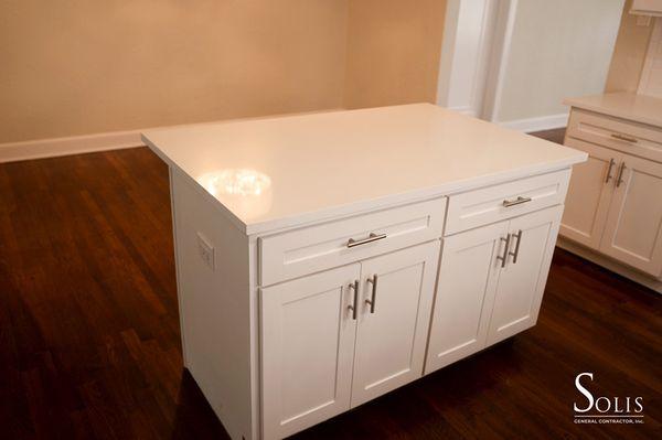 A Cottage Kitchen Island w/ White Quartz Shaker Style Cabinets Home Depot Pulls Plenty of Storage Space