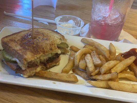 Brisket Cuban sandwich with fries.