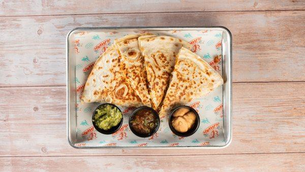 Burnt Ends Brisket Quesadilla, featuring tender, smoky brisket burnt ends enveloped in a crispy tortilla with melted cheese and fresh salsa.