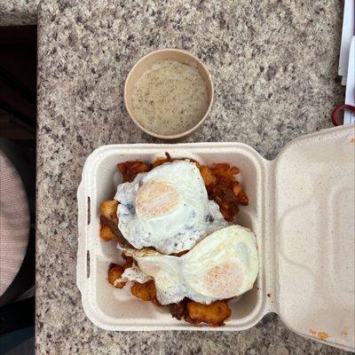 Breakfast horseshoe $19, with Nashville hot chicken, potatoes, 3 eggs, gravy, and biscuit.